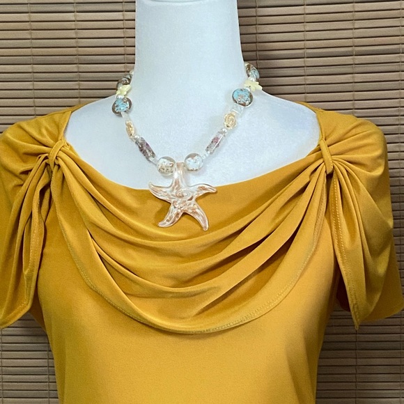 Darling gold blouse with draped neckline - Picture 2 of 10
